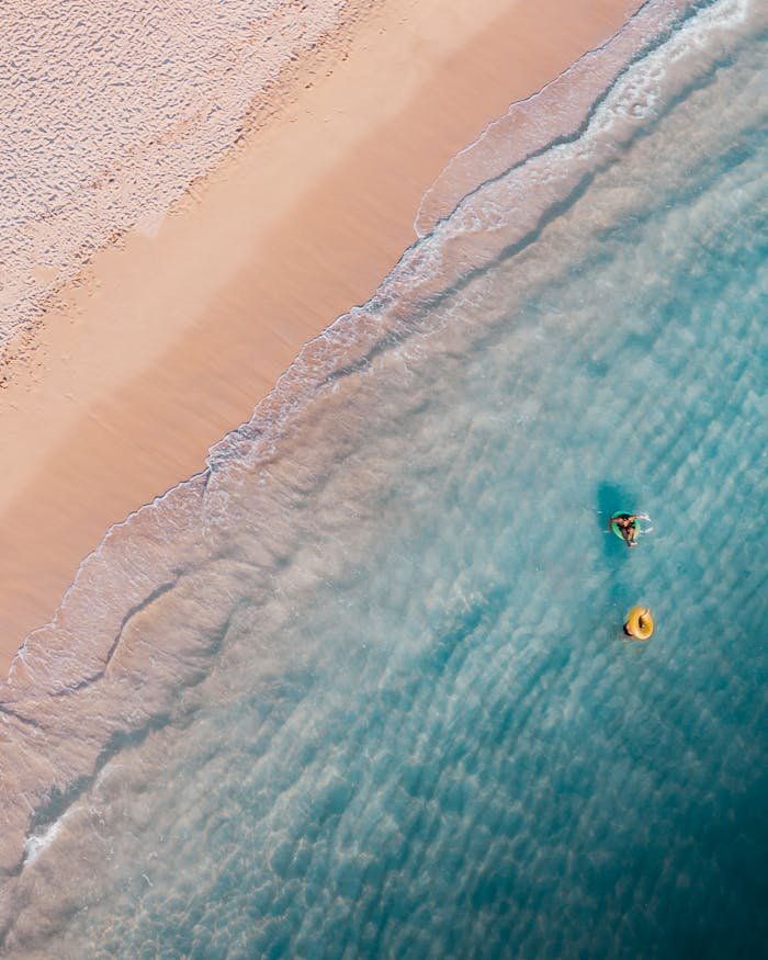 Person Surfing on Sea Waves